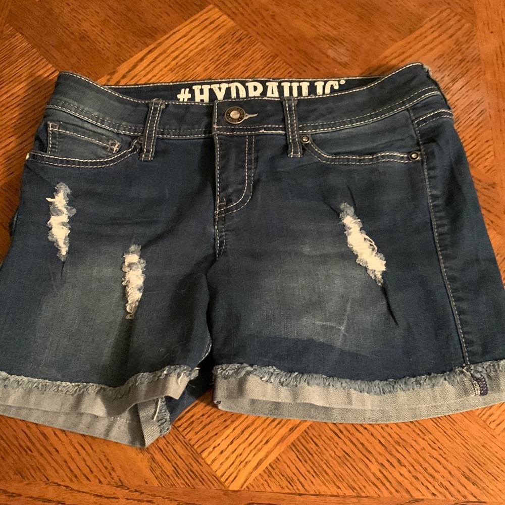longer jean shorts with subtle rips and bedazzled pockets